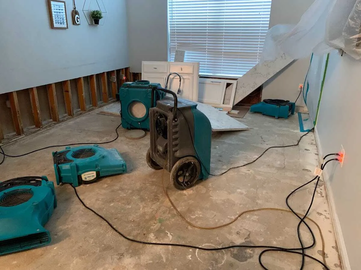Dehumidifier in flood-cut room for Water Damage Restoration in Dunbar